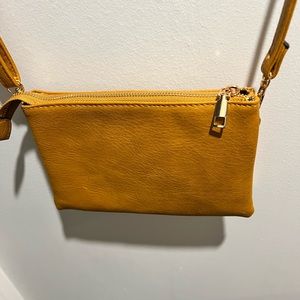 Beautiful mustard color crossbody. Excellent condition.